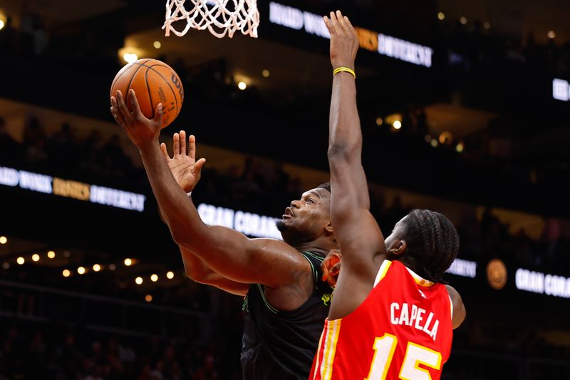 ATLANTA, GEORGIA - MARCH 10: Zion Williamson #1 of the New Orleans Pelicans goes up for a shot against Clint Capela #15 of the Atlanta Hawks during the third quarter at State Farm Arena on March 10, 2024 in Atlanta, Georgia. NOTE TO USER: User expressly acknowledges and agrees that, by downloading and or using this photograph, User is consenting to the terms and conditions of the Getty Images License Agreement. (Photo by Todd Kirkland/Getty Images)