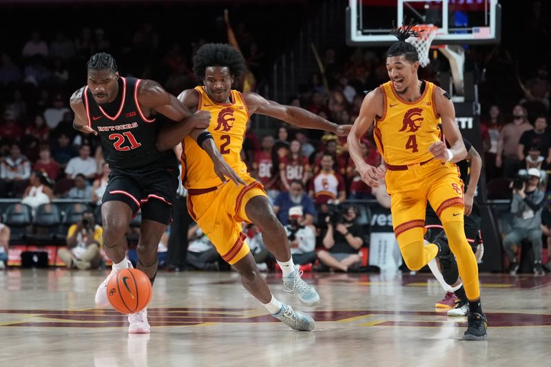 Jan 31, 2026; Los Angeles, California, USA; Rutgers Scarlet Knights center Emmanuel Ogbole (21) battles for the ball with Southern California Trojans forward Ezra Ausar (2) and center Gabe Dynes (45) in the second half at Galen Center. Mandatory Credit: Kirby Lee-Imagn Images