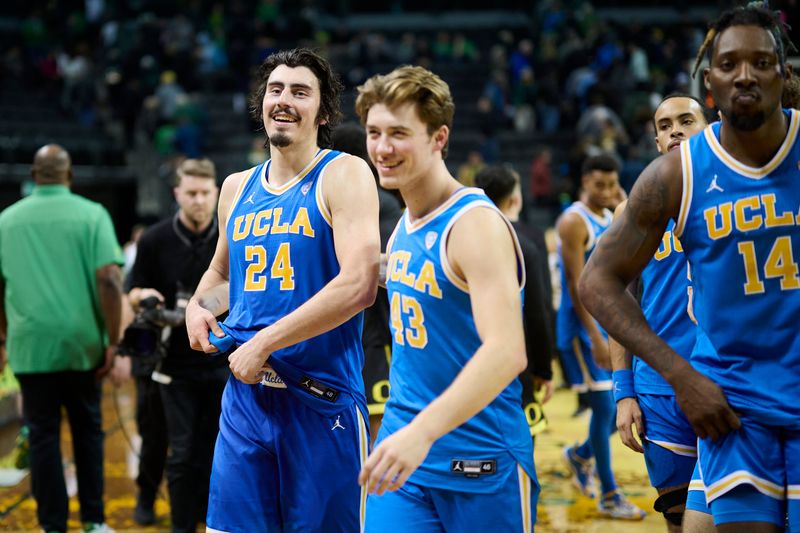 Feb 11, 2023; Eugene, Oregon, USA; UCLA Bruins guard Jaime Jaquez Jr. (24) celebrates with guard Russell Stong (43) after a game against the Oregon Ducks at Matthew Knight Arena. Mandatory Credit: Troy Wayrynen-USA TODAY Sports