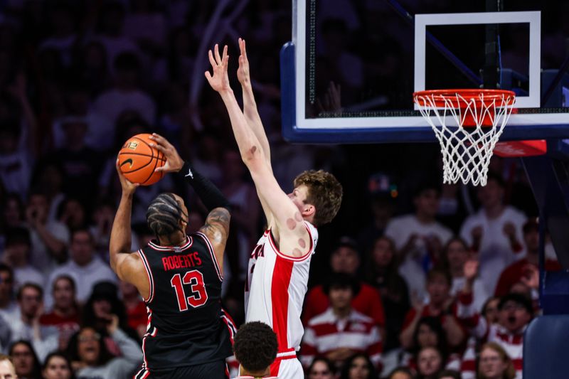 Feb 15, 2025; Tucson, Arizona, USA; Arizona Wildcats forward Henri Veesaar (13) attempts to block a shot made by Houston Cougars forward J’Wan Roberts (13) during the second half at McKale Center. Mandatory Credit: Aryanna Frank-Imagn Images