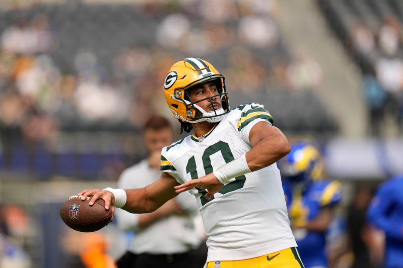 Green Bay Packers quarterback Jordan Love warms up before an NFL football game against the Los Angeles Rams, Sunday, Oct. 6, 2024, in Inglewood, Calif. (AP Photo/Gregory Bull)