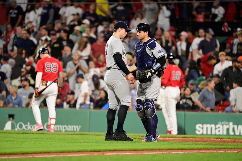 Sep 14, 2023; Boston, Massachusetts, USA; New York Yankees relief pitcher Tommy Kahnle (41) and catcher Kyle Higashioka (66) celebrate defeating the Boston Red Sox at Fenway Park. Mandatory Credit: Eric Canha-USA TODAY Sports