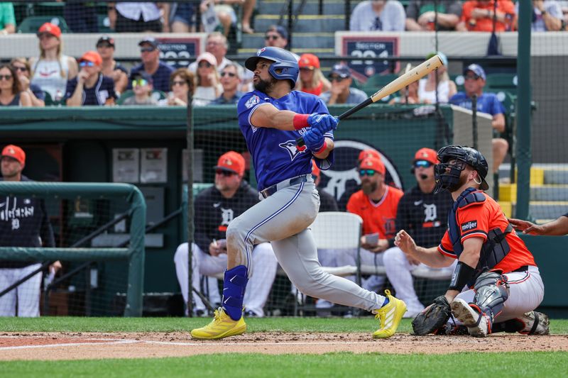 Mar 1, 2026; Lakeland, Florida, USA; Toronto Blue Jays left fielder Jonatan Clase (8) hits a two run double during the third inning against the Detroit Tigers at Publix Field at Joker Marchant Stadium. Mandatory Credit: Mike Watters-Imagn Images