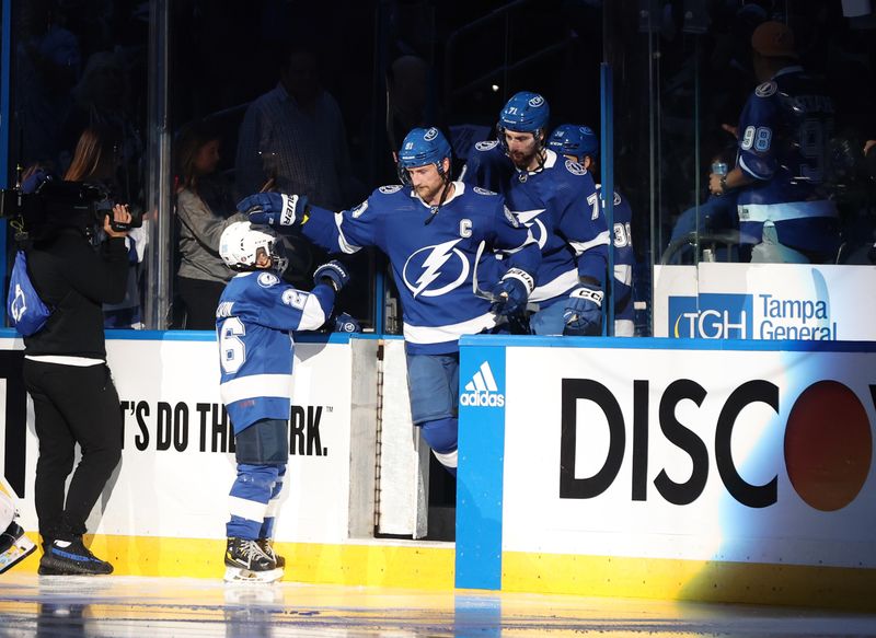 Apr 25, 2024; Tampa, Florida, USA; Tampa Bay Lightning center Steven Stamkos (91), center Anthony Cirelli (71)  and teammates skate onto the ice before the game against the Florida Panthers in game three of the first round of the 2024 Stanley Cup Playoffs at Amalie Arena. Mandatory Credit: Kim Klement Neitzel-USA TODAY Sports