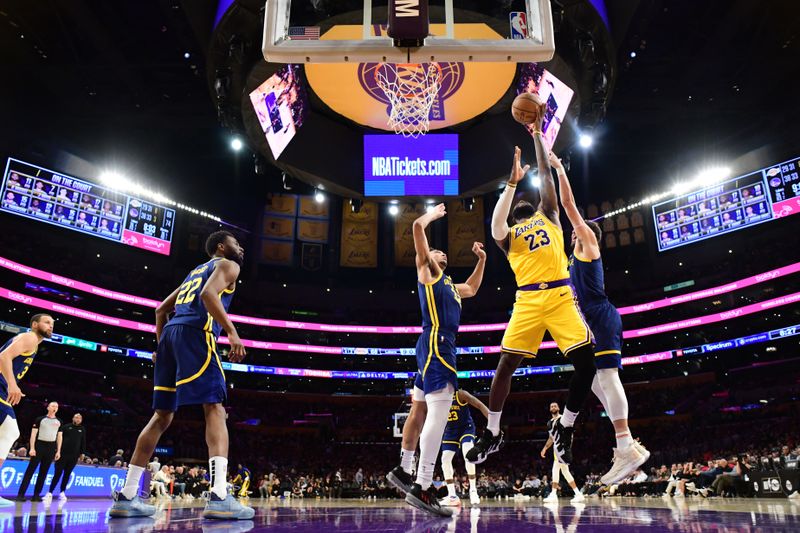 LOS ANGELES, CA - APRIL 9: LeBron James #23 of the Los Angeles Lakers drives to the basket during the game against the Golden State Warriors on April 9, 2024 at Crypto.Com Arena in Los Angeles, California. NOTE TO USER: User expressly acknowledges and agrees that, by downloading and/or using this Photograph, user is consenting to the terms and conditions of the Getty Images License Agreement. Mandatory Copyright Notice: Copyright 2024 NBAE (Photo by Adam Pantozzi/NBAE via Getty Images)