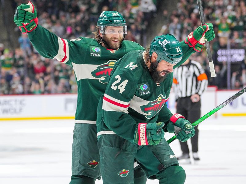 Nov 5, 2024; Saint Paul, Minnesota, USA; Minnesota Wild defenseman Zach Bogosian (24) celebrates his goal with right wing Ryan Hartman (38) against the Los Angeles Kings in the second period at Xcel Energy Center. Mandatory Credit: Brad Rempel-Imagn Images