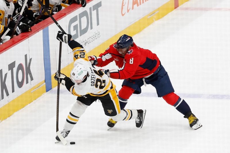 Nov 8, 2024; Washington, District of Columbia, USA; Washington Capitals left wing Alex Ovechkin (8) and Pittsburgh Penguins defenseman Matt Grzelcyk (24) battle for the puck in the first period at Capital One Arena. Mandatory Credit: Geoff Burke-Imagn Images