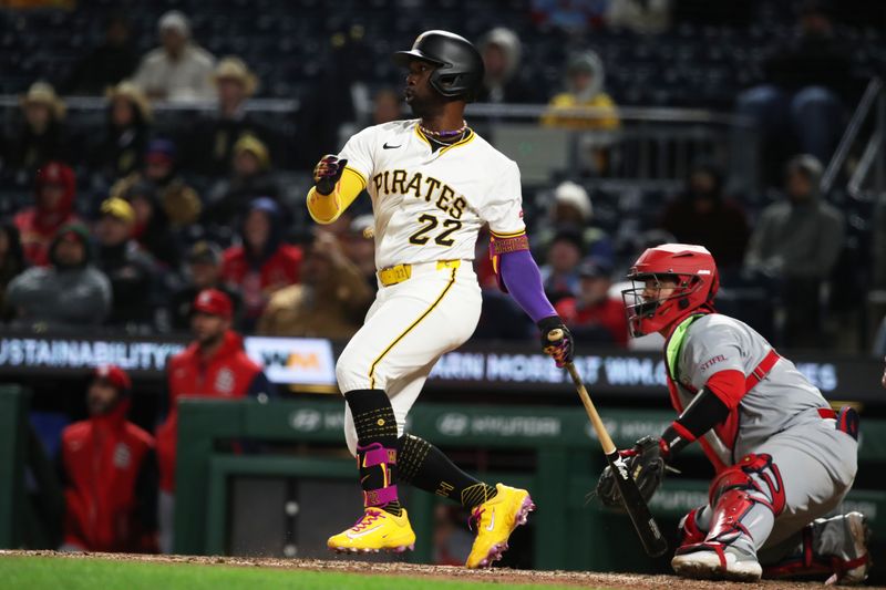 Apr 7, 2025; Pittsburgh, Pennsylvania, USA;  Pittsburgh Pirates right fielder Andrew McCutchen (22) hits a run to double against the St. Louis Cardinals during the seventh inning at PNC Park. Mandatory Credit: Charles LeClaire-Imagn Images