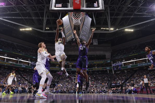 SACRAMENTO, CA - DECEMBER 16: Kris Dunn #11 of the Utah Jazz drives to the basket during the game against the Sacramento Kings on December 16, 2023 at Golden 1 Center in Sacramento, California. NOTE TO USER: User expressly acknowledges and agrees that, by downloading and or using this Photograph, user is consenting to the terms and conditions of the Getty Images License Agreement. Mandatory Copyright Notice: Copyright 2023 NBAE (Photo by Rocky Widner/NBAE via Getty Images)