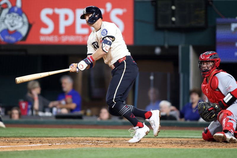 May 30, 2025; Arlington, Texas, USA; Texas Rangers third base Josh Jung (6) singles in two runs during the sixth inning against the St. Louis Cardinals at Globe Life Field. Mandatory Credit: Tim Heitman-Imagn Images