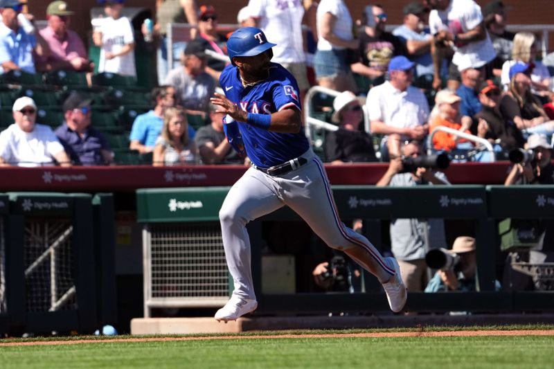 Mar 1, 2024; Scottsdale, Arizona, USA; Texas Rangers shortstop Ezequiel Duran scores a run against the San Francisco Giants during the second inning at Scottsdale Stadium. Mandatory Credit: Joe Camporeale-USA TODAY Sports