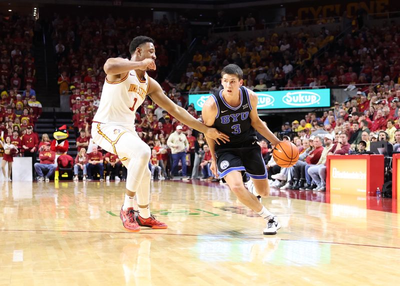 Mar 4, 2025; Ames, Iowa, USA; Iowa State Cyclones center Dishon Jackson (1) defends Brigham Young Cougars guard Egor Demin (3) during the second half at James H. Hilton Coliseum. Mandatory Credit: Reese Strickland-Imagn Images