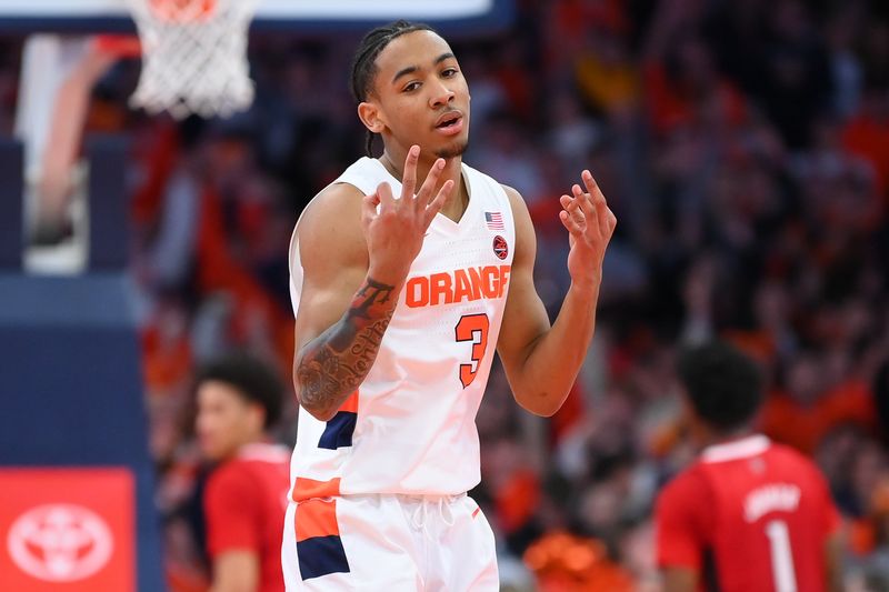 Feb 14, 2023; Syracuse, New York, USA; Syracuse Orange guard Judah Mintz (3) reacts to a made three-point basket against the North Carolina State Wolfpack during the second half at the JMA Wireless Dome. Mandatory Credit: Rich Barnes-USA TODAY Sports