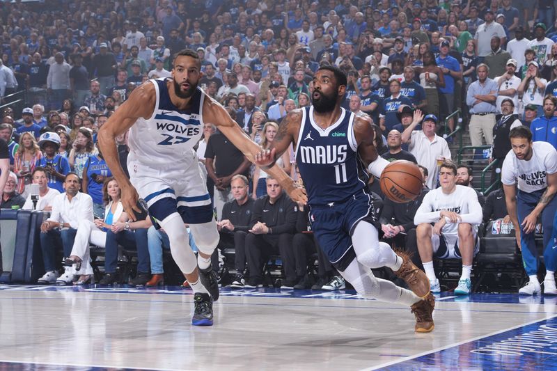DALLAS, TX - MAY 26: Kyrie Irving #11 of the Dallas Mavericks dribbles the ball during the game against the Minnesota Timberwolves during Game 3 of the Western Conference Finals of the 2024 NBA Playoffs on May 26, 2024 at the American Airlines Center in Dallas, Texas. NOTE TO USER: User expressly acknowledges and agrees that, by downloading and or using this photograph, User is consenting to the terms and conditions of the Getty Images License Agreement. Mandatory Copyright Notice: Copyright 2024 NBAE (Photo by Jesse D. Garrabrant/NBAE via Getty Images)