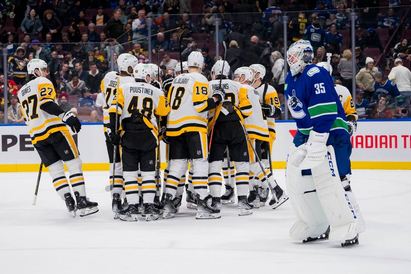 Feb 27, 2024; Vancouver, British Columbia, CAN; The Pittsburgh Penguins celebrate their victrory in overtime as Vancouver Canucks goalie Thatcher Demko (35) skates off the ice at Rogers Arena. Penguins won 4-3 in overtime. Mandatory Credit: Bob Frid-USA TODAY Sports