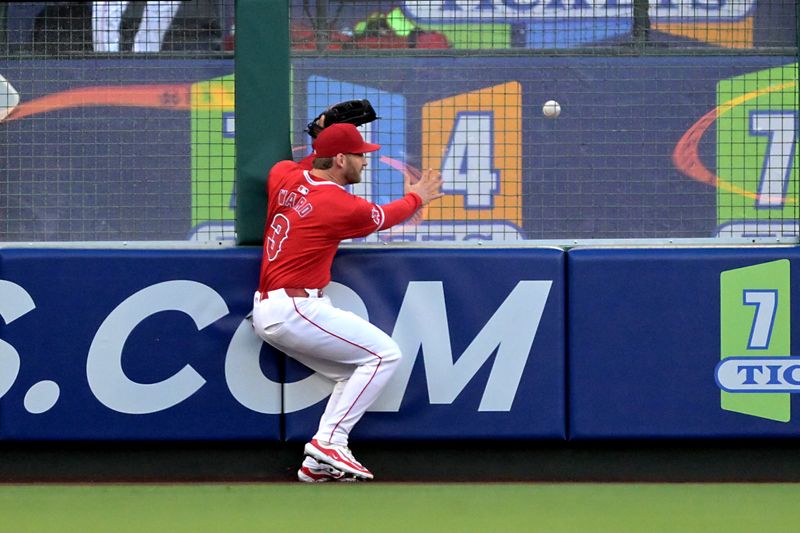 May 9, 2024; Anaheim, California, USA;  Los Angeles Angels outfielder Taylor Ward (3) runs into the fence as the two-run home run ball of Kansas City Royals outfielder Dairon Blanco (44) bounces in the bullpen during the third inning at Angel Stadium. Mandatory Credit: Jayne Kamin-Oncea-USA TODAY Sports