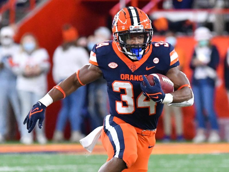 Oct 30, 2021; Syracuse, New York, USA; Syracuse Orange running back Sean Tucker (34) cuts upfield against the Boston College Eagles in the first quarter at the Carrier Dome. Mandatory Credit: Mark Konezny-USA TODAY Sports