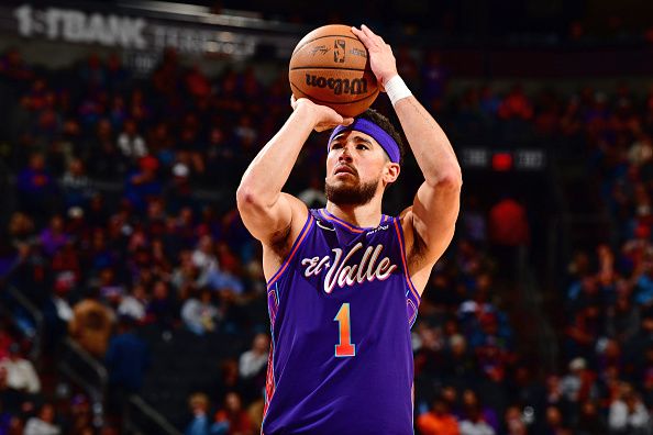 PHOENIX, AZ - DECEMBER 29: Devin Booker #1 of the Phoenix Suns shoots a free throw during the game against the Charlotte Hornets on December 29 2023 at Footprint Center in Phoenix, Arizona. NOTE TO USER: User expressly acknowledges and agrees that, by downloading and or using this photograph, user is consenting to the terms and conditions of the Getty Images License Agreement. Mandatory Copyright Notice: Copyright 2023 NBAE (Photo by Barry Gossage/NBAE via Getty Images)