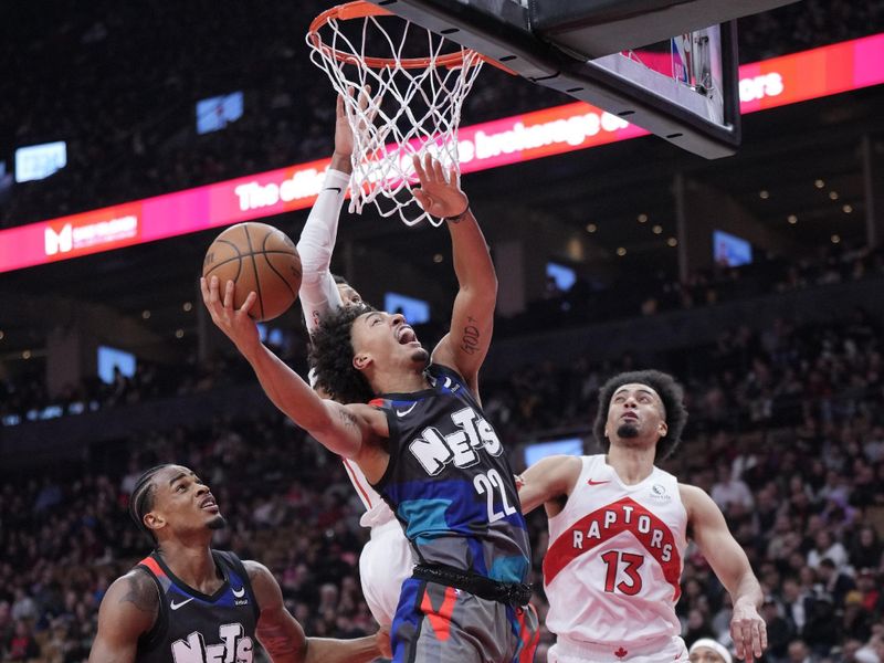 TORONTO, ON - MARCH 25: Jalen Wilson #22 of the Brooklyn Nets goes to the basket against Jordan Nwora #13 of the Toronto Raptors during the first half at the Scotiabank Arena on March 25, 2024 in Toronto, Ontario, Canada. NOTE TO USER: User expressly acknowledges and agrees that, by downloading and/or using this Photograph, user is consenting to the terms and conditions of the Getty Images License Agreement. (Photo by Mark Blinch/Getty Images)