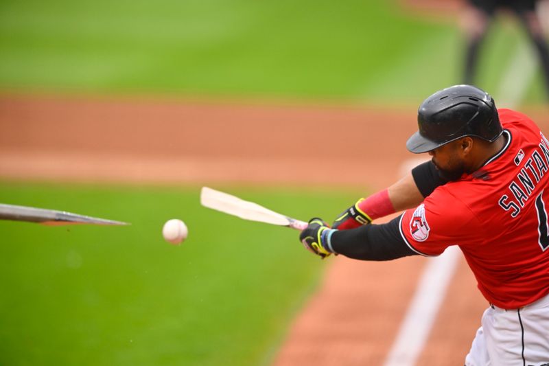 May 27, 2025; Cleveland, Ohio, USA; Cleveland Guardians first baseman Carlos Santana (41) breaks his bat on an infield single in the second inning against the Los Angeles Dodgers at Progressive Field. Mandatory Credit: David Richard-Imagn Images