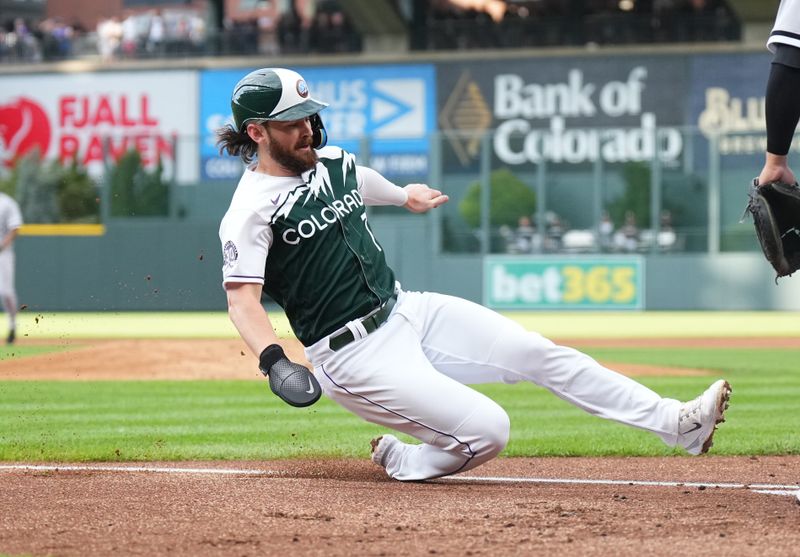 Aug 19, 2023; Denver, Colorado, USA; Colorado Rockies second baseman Brendan Rodgers (7) scores in the first inning against the Chicago White Sox  at Coors Field. Mandatory Credit: Ron Chenoy-USA TODAY Sports