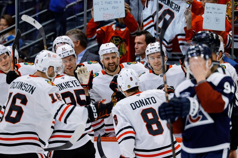 Oct 28, 2024; Denver, Colorado, USA; Chicago Blackhawks left wing Nick Foligno (17) and left wing Taylor Hall (71) and center Philipp Kurashev (23) celebrate with right wing Ilya Mikheyev (95) and center Ryan Donato (8) and center Jason Dickinson (16) after a goal against the Colorado Avalanche in the third period at Ball Arena. Mandatory Credit: Isaiah J. Downing-Imagn Images