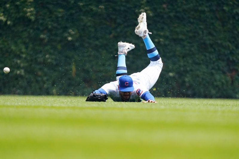 Jun 18, 2023; Chicago, Illinois, USA; Chicago Cubs center fielder Mike Tauchman (40) can t make a catch on Baltimore Orioles left fielder Austin Hays (21) during the first inning at Wrigley Field. Mandatory Credit: David Banks-USA TODAY Sports