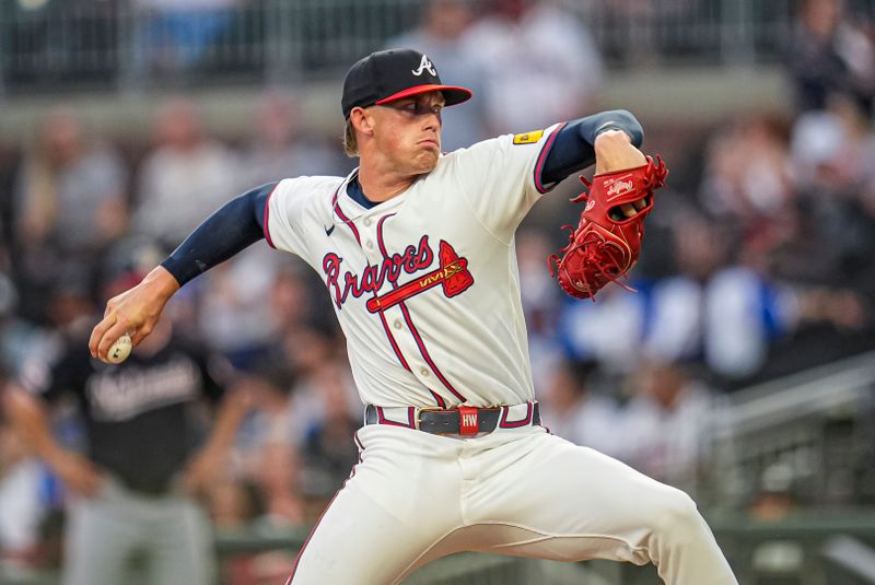 Sep 23, 2025; Cumberland, Georgia, USA; Atlanta Braves starting pitcher Hurston Waldrep (64) pitches against the Washington Nationals during the first inning at Truist Park. Mandatory Credit: Dale Zanine-Imagn Images