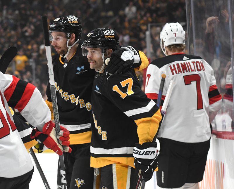 Nov 16, 2023; Pittsburgh, Pennsylvania, USA; Pittsburgh Penguins right wing Bryan Rust (17) celebrates a goal with defenseman Marcus Pettersson (28) against the New Jersey Devils during the first period at PPG Paints Arena. Mandatory Credit: Philip G. Pavely-USA TODAY Sports