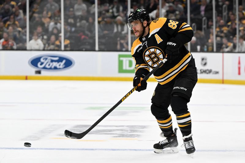 Oct 1, 2024; Boston, Massachusetts, USA; Boston Bruins right wing David Pastrnak (88) passes the puck during the first period of a game against the Philadelphia Flyers at the TD Garden. Mandatory Credit: Brian Fluharty-Imagn Images