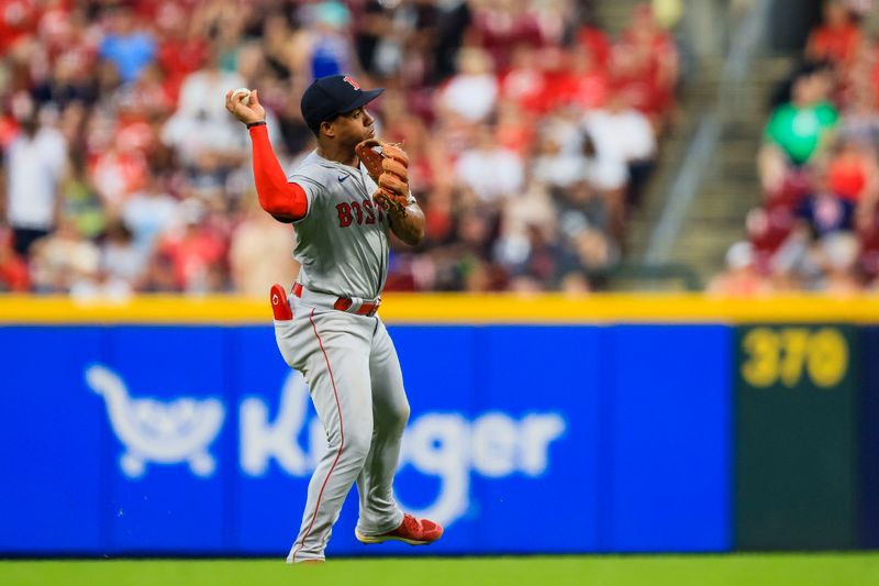 Jun 21, 2024; Cincinnati, Ohio, USA; Boston Red Sox second baseman Enmanuel Valdez (47) throws to first in attempt to get Cincinnati Reds third baseman Santiago Espinal (not pictured) out in the seventh inning at Great American Ball Park. Mandatory Credit: Katie Stratman-USA TODAY Sports