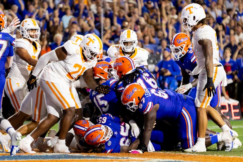 Sep 16, 2023; Gainesville, Florida, USA; Florida Gators quarterback Graham Mertz (15) scores a touchdown during the first half against the Tennessee Volunteers at Ben Hill Griffin Stadium. Mandatory Credit: Matt Pendleton-USA TODAY Sports