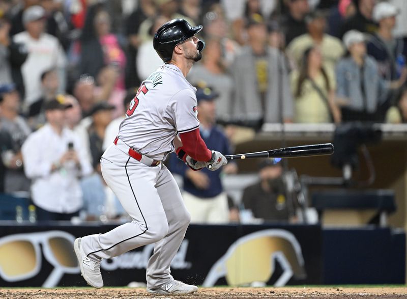 July 5, 2024; San Diego, California, USA; Arizona Diamondbacks right fielder Randal Grichuk (15) hits a two-run home run during the ninth inning against the San Diego Padres at Petco Park. Mandatory Credit: Denis Poroy-USA TODAY Sports