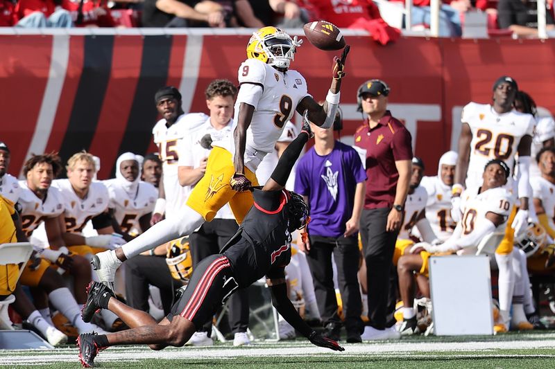 Nov 4, 2023; Salt Lake City, Utah, USA; Utah Utes cornerback Miles Battle (1) and Arizona State Sun Devils wide receiver Troy Omeire (9) play for a pass in the third quarter at Rice-Eccles Stadium. Mandatory Credit: Rob Gray-USA TODAY Sports