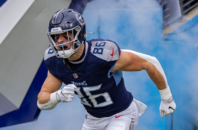 Tennessee Titans tight end Kevin Rader (86) enters the stadium as he's introduced before their NFL football game against the Jacksonville Jaguars Sunday, Jan. 7, 2024, in Nashville, Tenn. (AP Photo/Wade Payne)