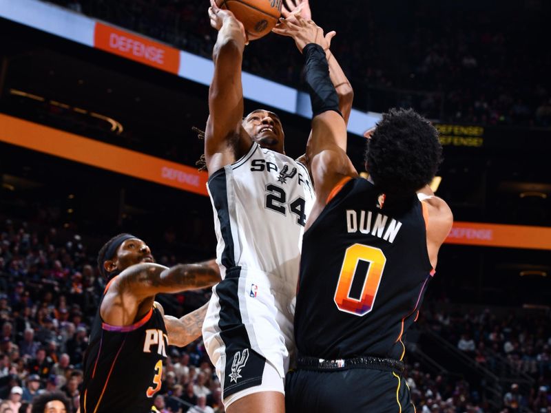 PHOENIX, AZ - DECEMBER 3: Devin Vassell #24 of the San Antonio Spurs drives to the basket during the game against the Phoenix Suns during a Emirates NBA Cup game on December 3, 2024 at Footprint Center in Phoenix, Arizona. NOTE TO USER: User expressly acknowledges and agrees that, by downloading and or using this photograph, user is consenting to the terms and conditions of the Getty Images License Agreement. Mandatory Copyright Notice: Copyright 2024 NBAE (Photo by Barry Gossage/NBAE via Getty Images)