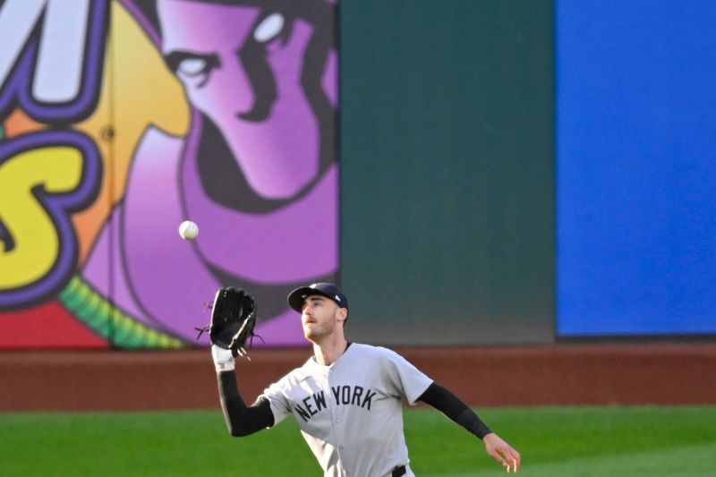 Apr 22, 2025; Cleveland, Ohio, USA; New York Yankees center fielder Cody Bellinger (35) makes a catch in the third inning against the Cleveland Guardians at Progressive Field. Mandatory Credit: David Richard-Imagn Images