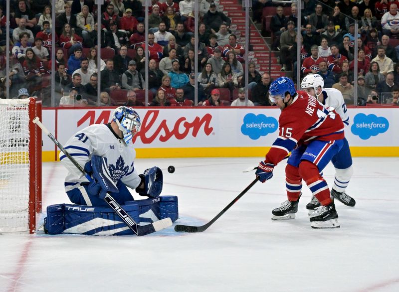 Oct 9, 2024; Montreal, Quebec, CAN; Toronto Maple Leafs  (41) stops Montreal Canadiens forward Alex Newhook (15) during the second period at the Bell Centre. Mandatory Credit: Eric Bolte-Imagn Images