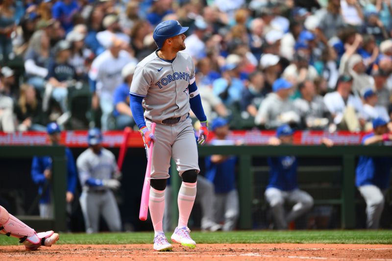 May 11, 2025; Seattle, Washington, USA; Toronto Blue Jays designated hitter George Springer (4) hits a 3-run home run against the Seattle Mariners during the fifth inning at T-Mobile Park. Mandatory Credit: Steven Bisig-Imagn Images