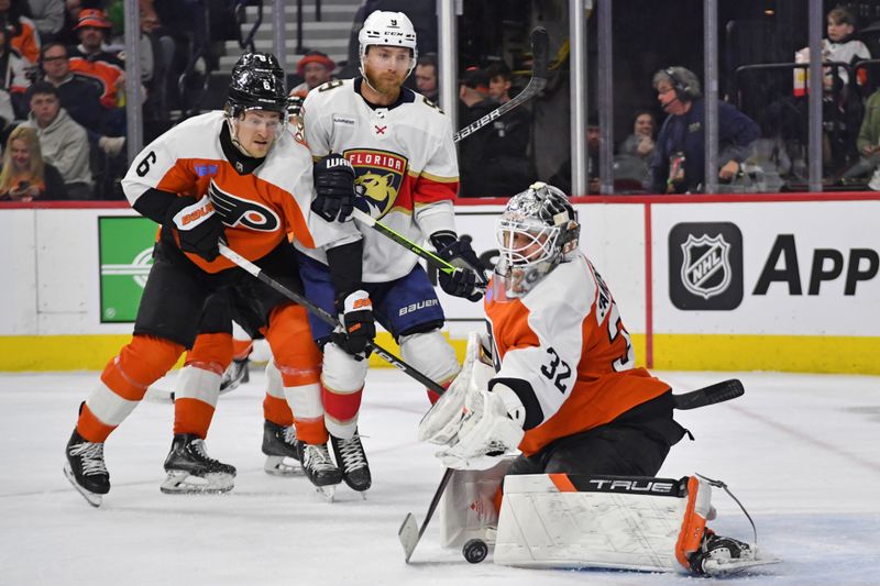 Mar 24, 2024; Philadelphia, Pennsylvania, USA; Philadelphia Flyers goaltender Felix Sandstrom (32) makes a save against the Florida Panthers as defenseman Travis Sanheim (6) defends against Florida Panthers center Sam Bennett (9) during the second period at Wells Fargo Center. Mandatory Credit: Eric Hartline-USA TODAY Sports