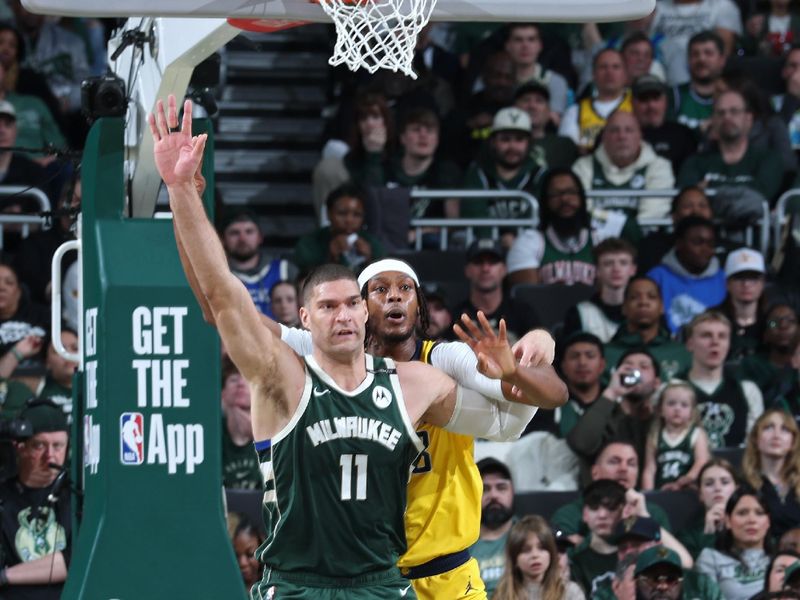 MILWAUKEE, WI - APRIL 25: Brook Lopez #11 of the Milwaukee Bucks and Myles Turner #33 of the Indiana Pacers look on during the game during Round 1 Game 3 of the 2025 NBA Playoffs on April 25, 2025 at Fiserv Forum Center in Milwaukee, Wisconsin. NOTE TO USER: User expressly acknowledges and agrees that, by downloading and or using this Photograph, user is consenting to the terms and conditions of the Getty Images License Agreement. Mandatory Copyright Notice: Copyright 2025 NBAE(Photo by Jeff Haynes/NBAE via Getty Images).