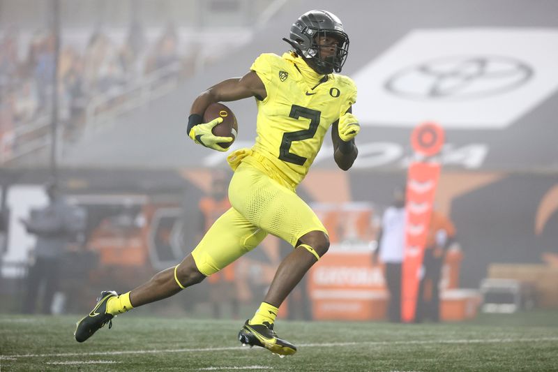 Nov 27, 2020; Corvallis, Oregon, USA; Oregon Ducks  wide receiver Devon Williams (2) runs the ball for a touchdown against the Oregon State Beavers during the first half at Reser Stadium. Mandatory Credit: Soobum Im-USA TODAY Sports