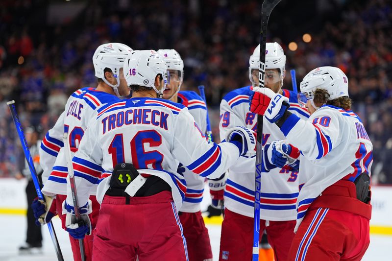 Nov 29, 2024; Philadelphia, Pennsylvania, USA; New York Rangers center Vincent Trocheck (16) celebrates with teammates after scoring a goal against the Philadelphia Flyers in the second period at Wells Fargo Center. Mandatory Credit: Kyle Ross-Imagn Images