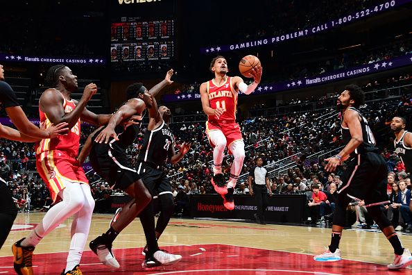 ATLANTA, GA - DECEMBER 6: Trae Young #11 of the Atlanta Hawks drives to the basket during the game against the Brooklyn Nets on December 6, 2023 at State Farm Arena in Atlanta, Georgia.  NOTE TO USER: User expressly acknowledges and agrees that, by downloading and/or using this Photograph, user is consenting to the terms and conditions of the Getty Images License Agreement. Mandatory Copyright Notice: Copyright 2023 NBAE (Photo by Scott Cunningham/NBAE via Getty Images)