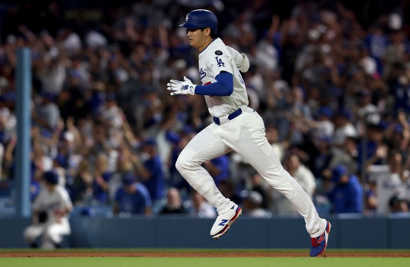 May 30, 2025; Los Angeles, California, USA; Los Angeles Dodgers designated hitter Shohei Ohtani (17) rounds the bases after hitting a home run during the sixth inning against the New York Yankees at Dodger Stadium. Mandatory Credit: Jason Parkhurst-Imagn Images