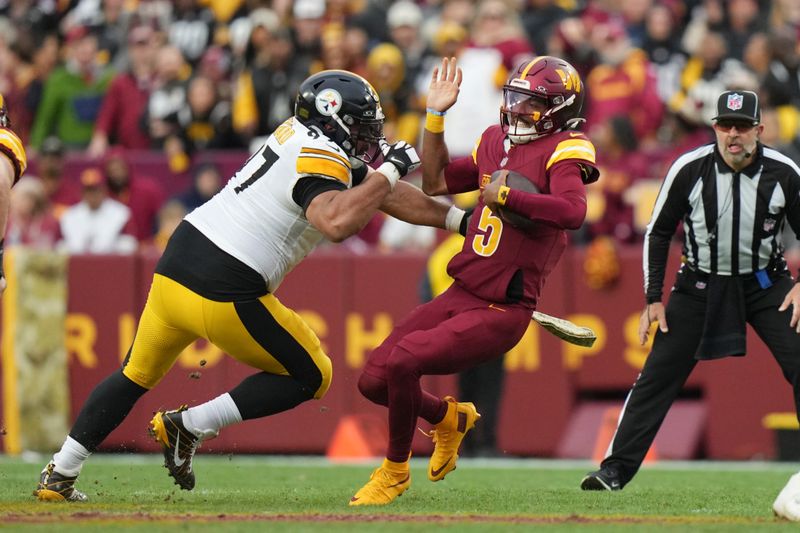 Pittsburgh Steelers defensive tackle Cameron Heyward (97) sacks Washington Commanders quarterback Jayden Daniels (5) during the second half of an NFL football game, Sunday, Nov. 10, 2024, in Landover, Md. (AP Photo/Stephanie Scarbrough)