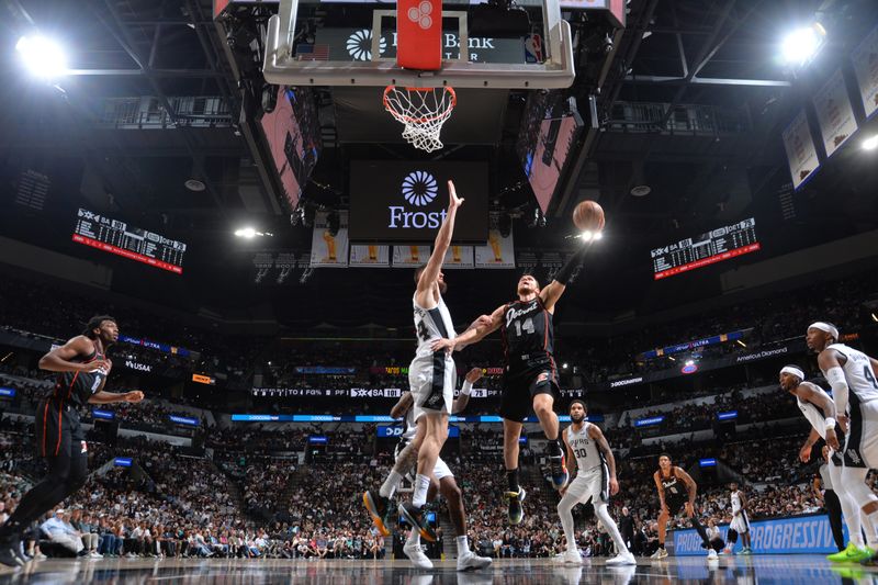 SAN ANTONIO, TX - APRIL 14: Malachi Flynn #14 of the Detroit Pistons drives to the basket during the game against the San Antonio Spurs on April 14, 2024 at the Frost Bank Center in San Antonio, Texas. NOTE TO USER: User expressly acknowledges and agrees that, by downloading and or using this photograph, user is consenting to the terms and conditions of the Getty Images License Agreement. Mandatory Copyright Notice: Copyright 2024 NBAE (Photos by Michael Gonzales/NBAE via Getty Images)