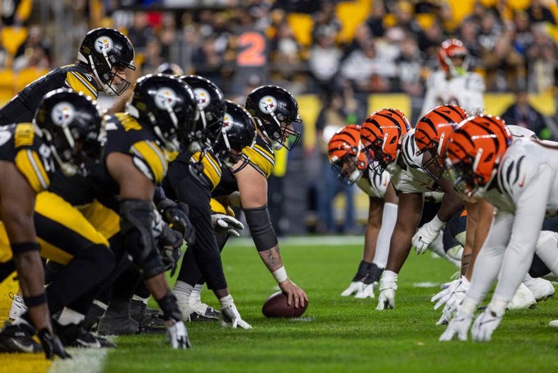 Pittsburgh Steelers center Mason Cole (61) readies to snap the ball against the Cincinnati Bengals during an NFL football game, Saturday, Dec. 23, 2023, in Pittsburgh. (AP Photo/Matt Durisko)