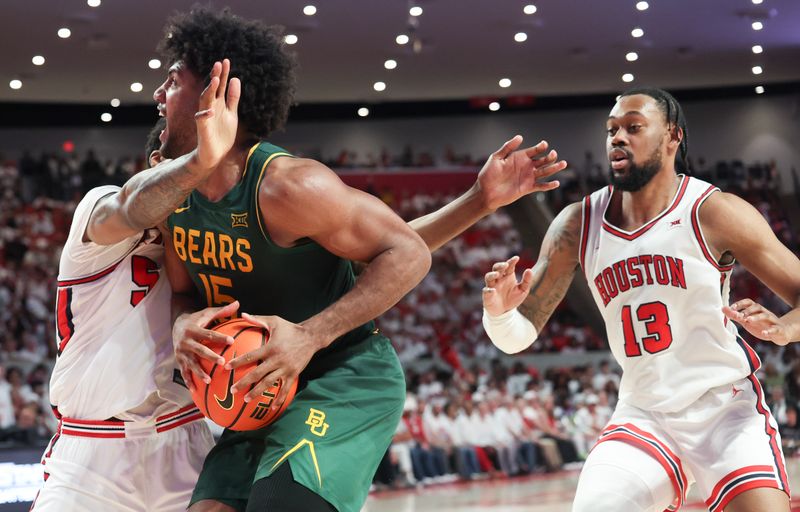 Feb 10, 2025; Houston, Texas, USA; Baylor Bears forward Norchad Omier (15) is guarded by Houston Cougars forward Ja'Vier Francis (5)  in the second half at Fertitta Center. Mandatory Credit: Thomas Shea-Imagn Images