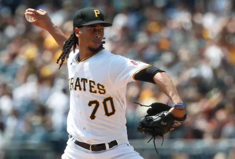 Jul 16, 2023; Pittsburgh, Pennsylvania, USA; Pittsburgh Pirates starting pitcher Osvaldo Bido (70) delivers a pitch against the San Francisco Giants during the first inning at PNC Park. Mandatory Credit: Charles LeClaire-USA TODAY Sports